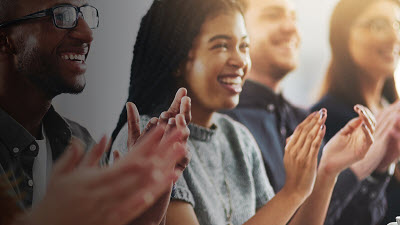 a group of people clapping