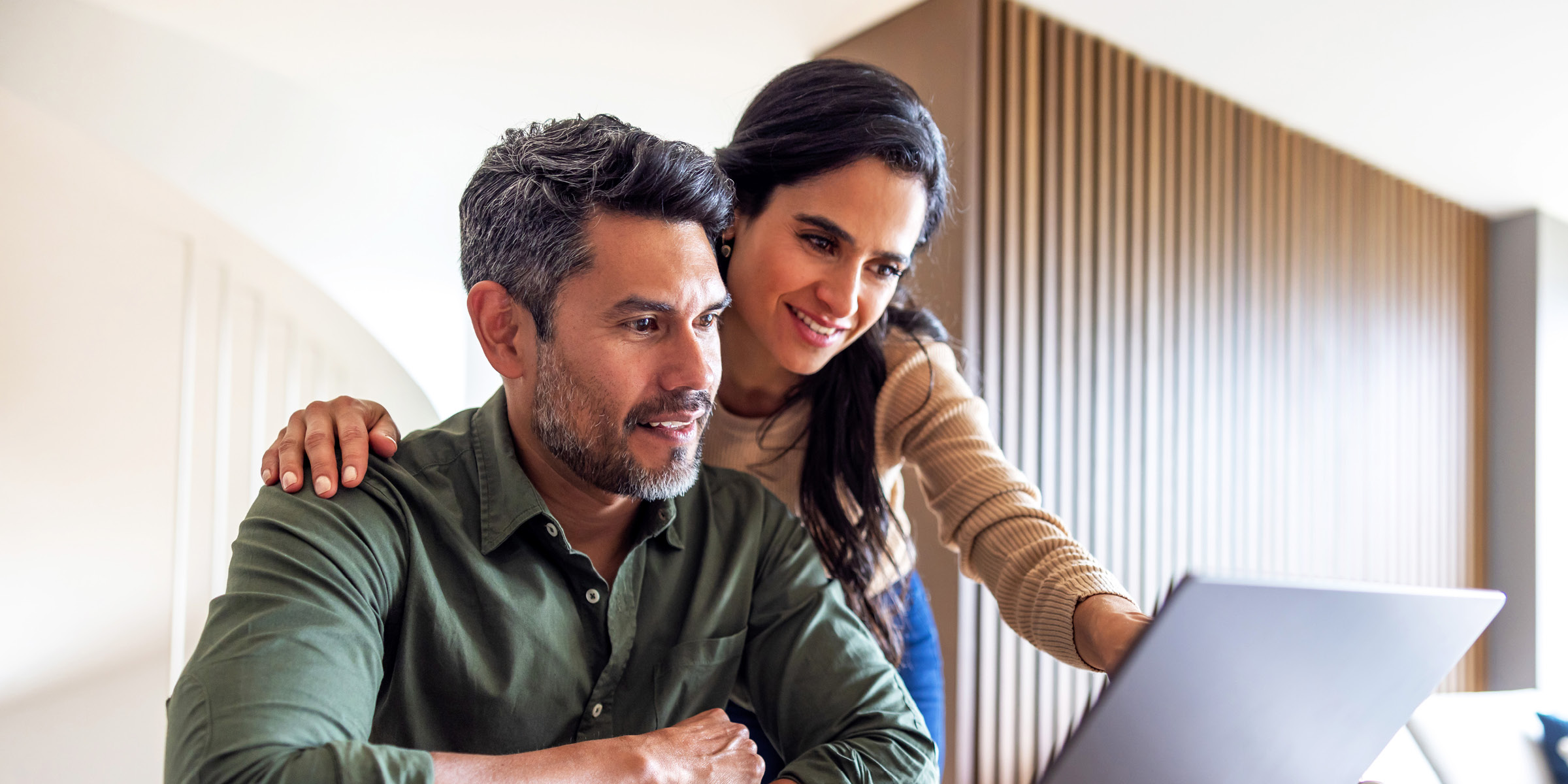 a couple using a laptop